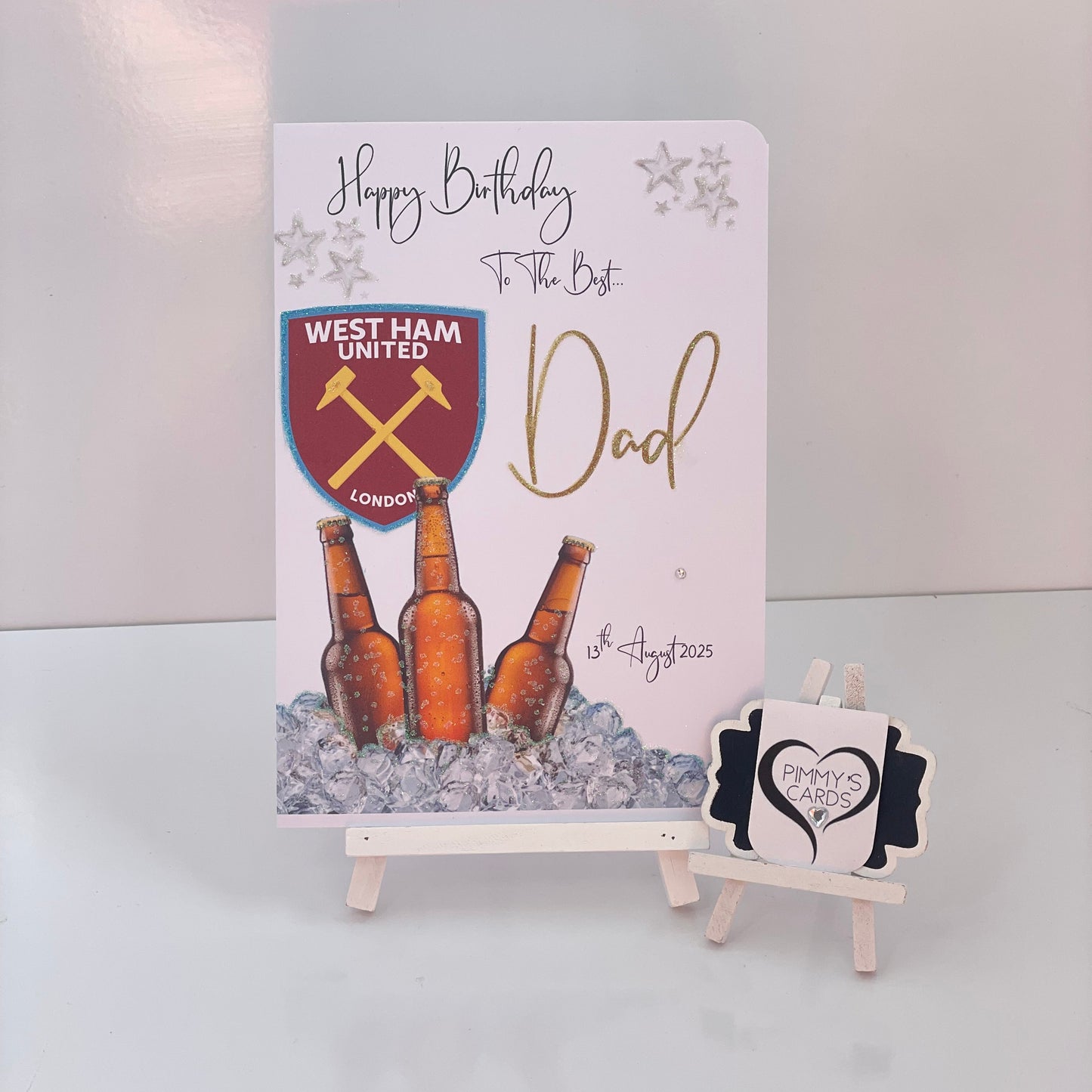 Greeting card with West Ham United logo and beer bottles.