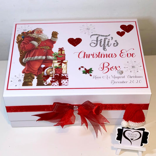 Personalised Christmas Eve box with traditional father Christmas design and red ribbon.