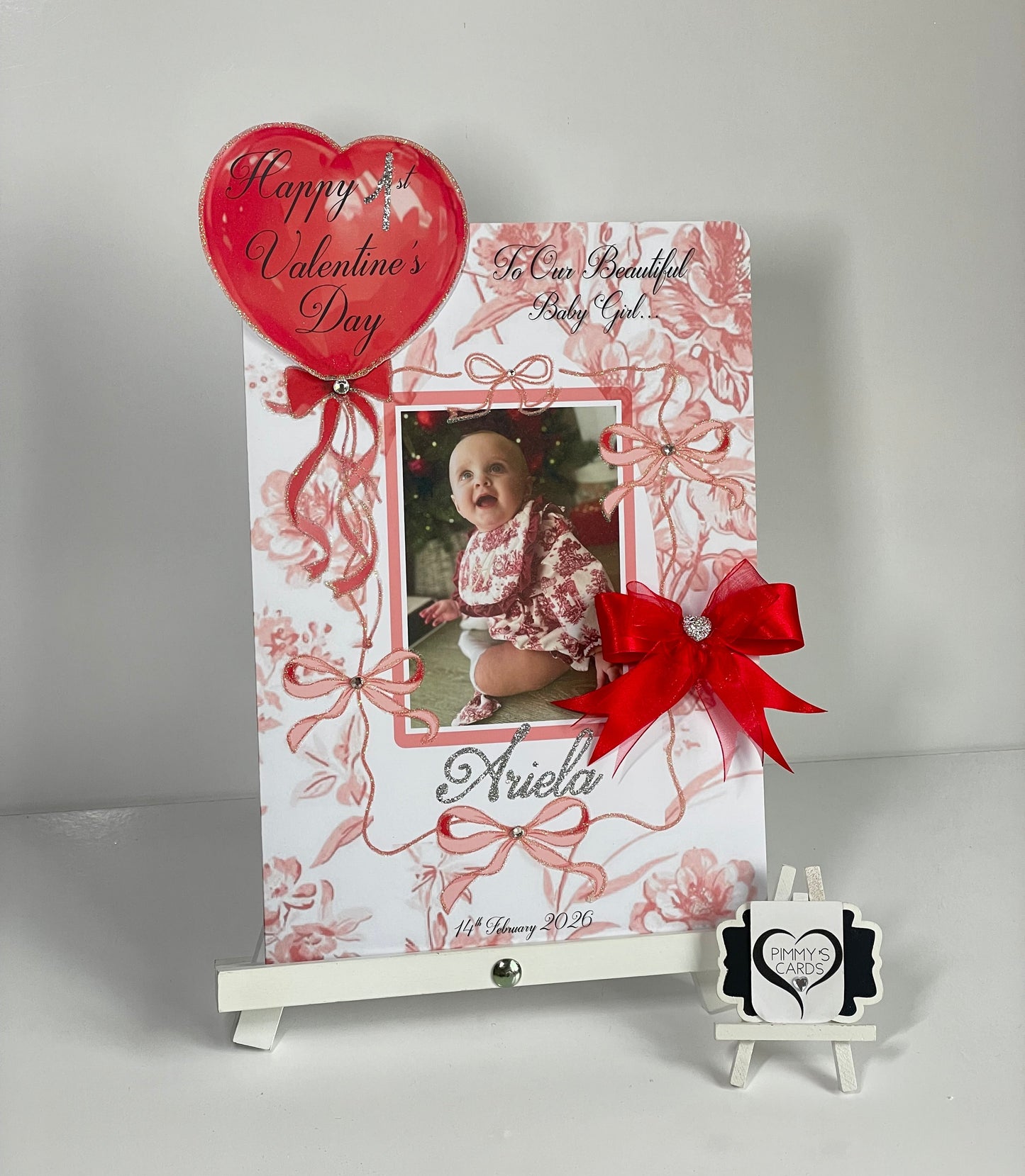 Valentine's Day card with a photo, red bow, and decorative elements on a white background. Personalised red bow toile theme. First Valentine’s Day card for babies first Valentine.