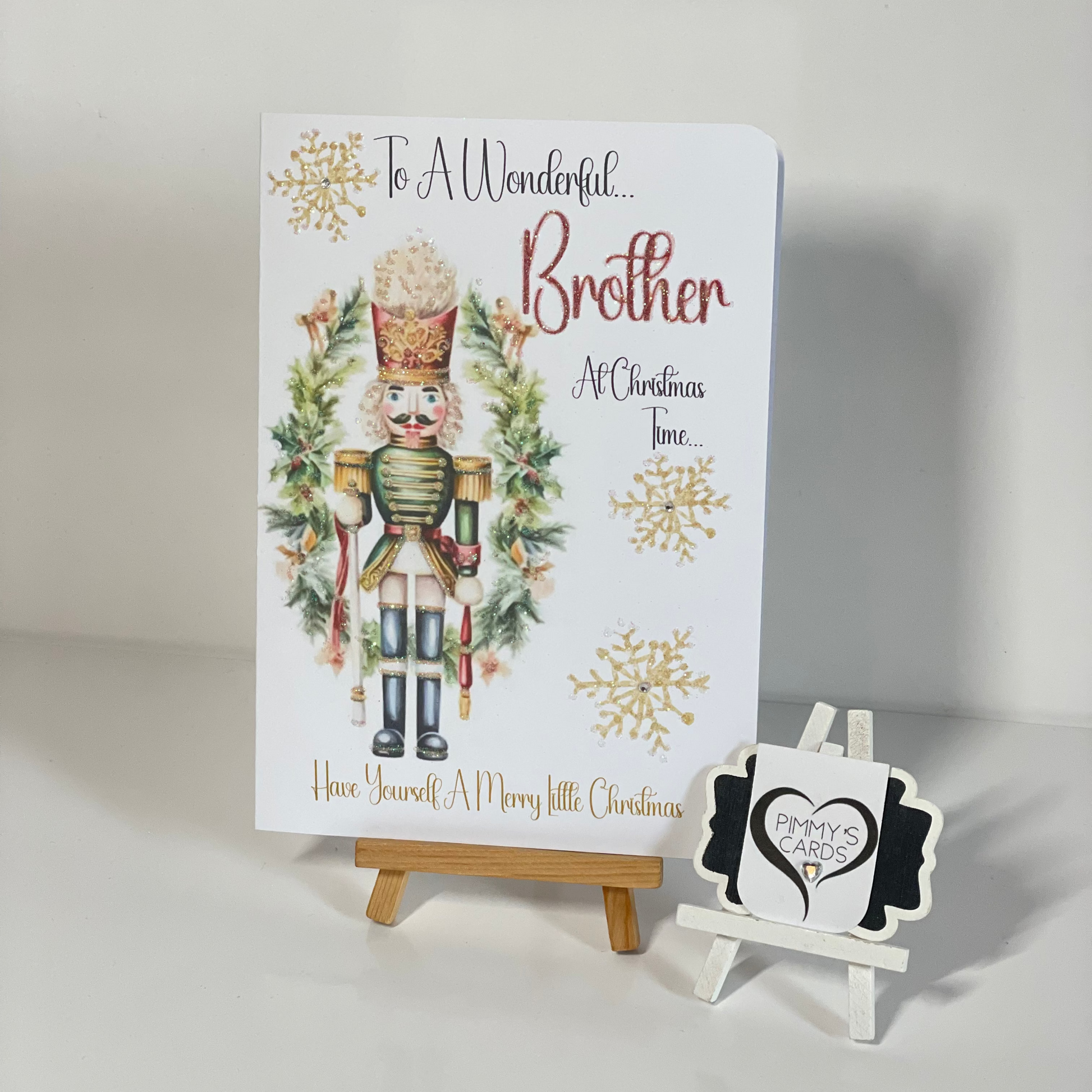 Christmas card with nutcracker design on a white background