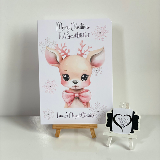 Christmas card with a cute reindeer design pink theme