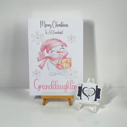 Christmas card for granddaughter with a snowman illustration on a white background