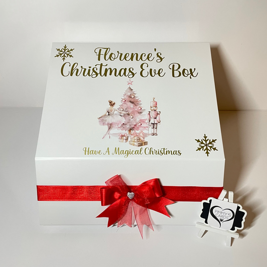 Personalised Christmas Eve box with festive design and red ribbon on a white background