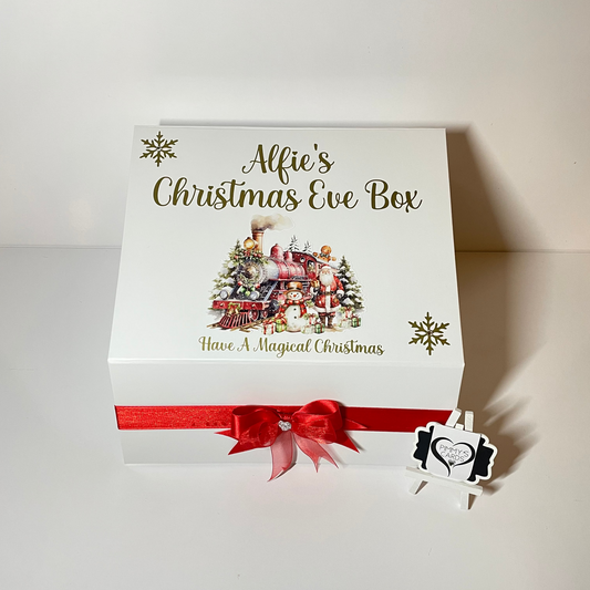 Personalised Christmas Eve box with festive design and red ribbon.