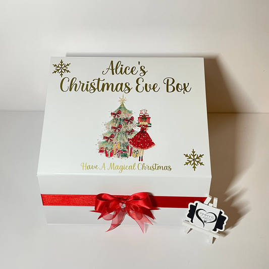 Personalised Christmas Eve box with festive design and red ribbon.