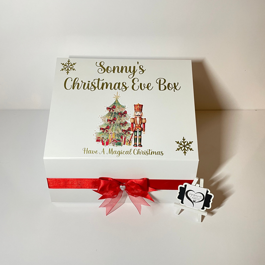 Personalised Christmas Eve box with festive design and red ribbon.