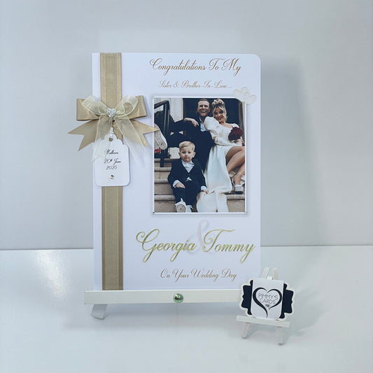 Personalised wedding photo card of Georgia Kousoulou & Tommy Mallet Gold theme with bow