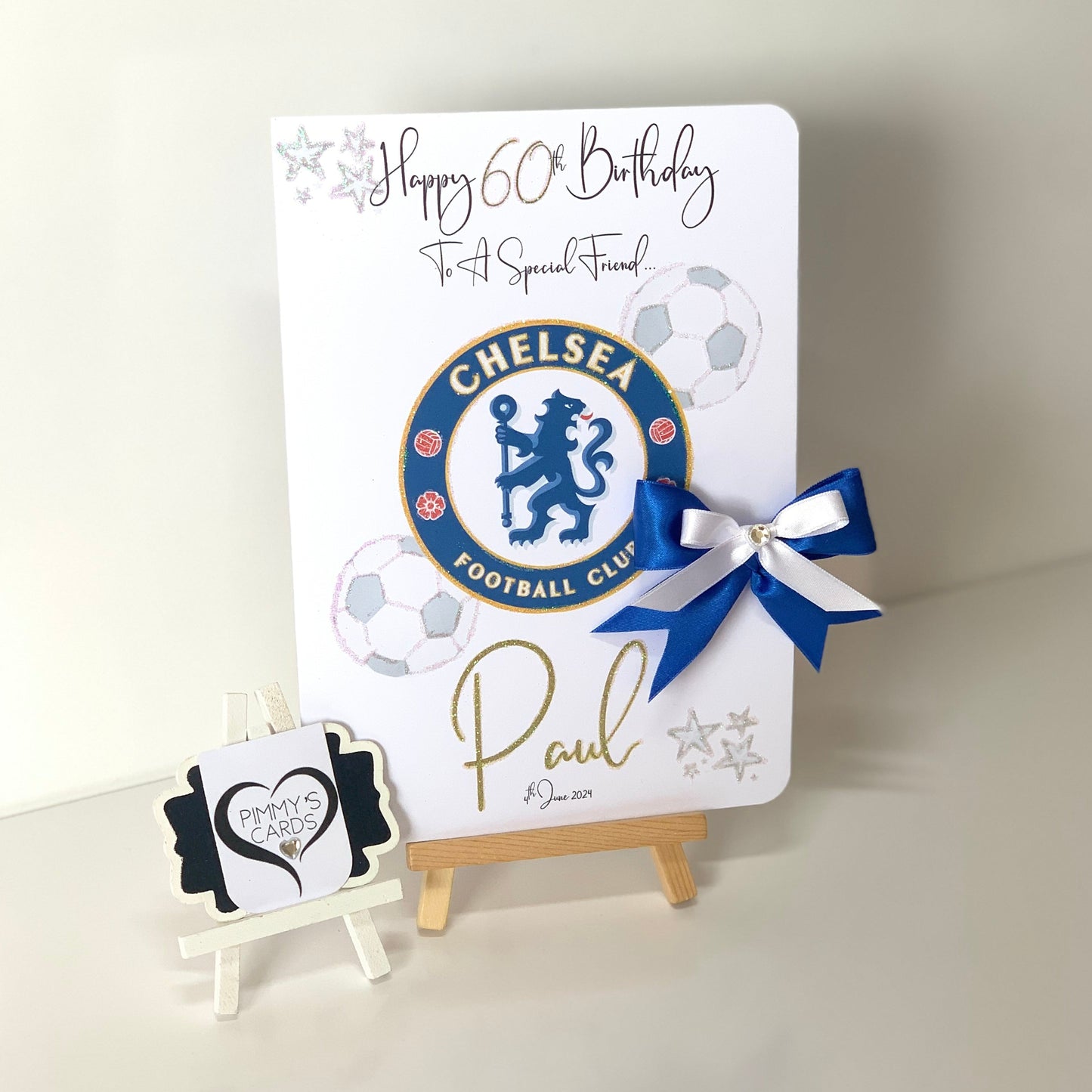 Birthday card with Chelsea Football Club logo and a blue ribbon on a white background