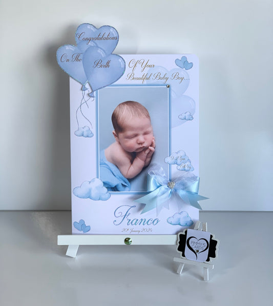 Baby photo frame with a baby's picture, balloons, and text on a white background
