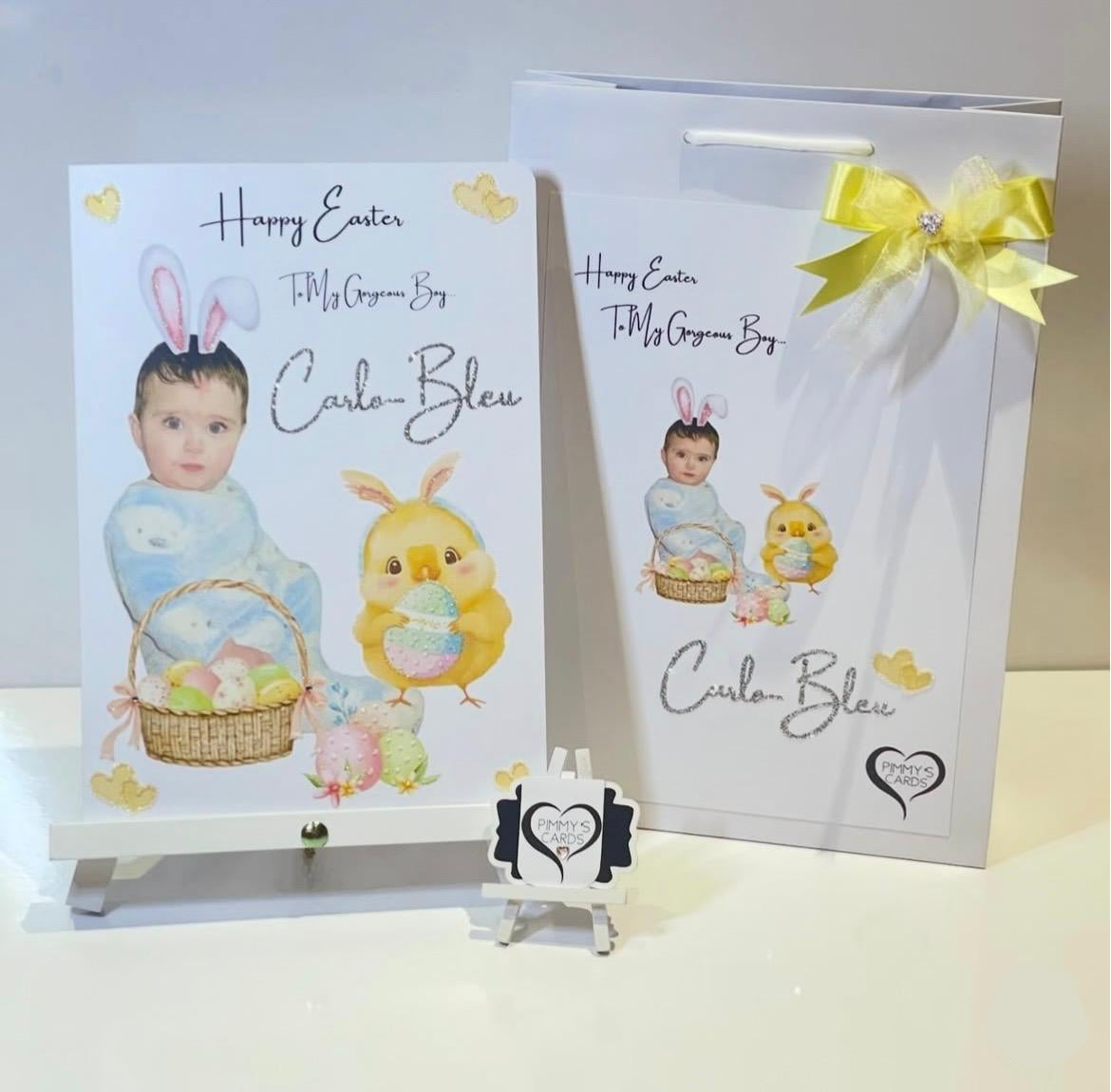 Easter-themed greeting card and gift bag with a baby's face and chick design, featuring the brand 'Carlo Bleu'.